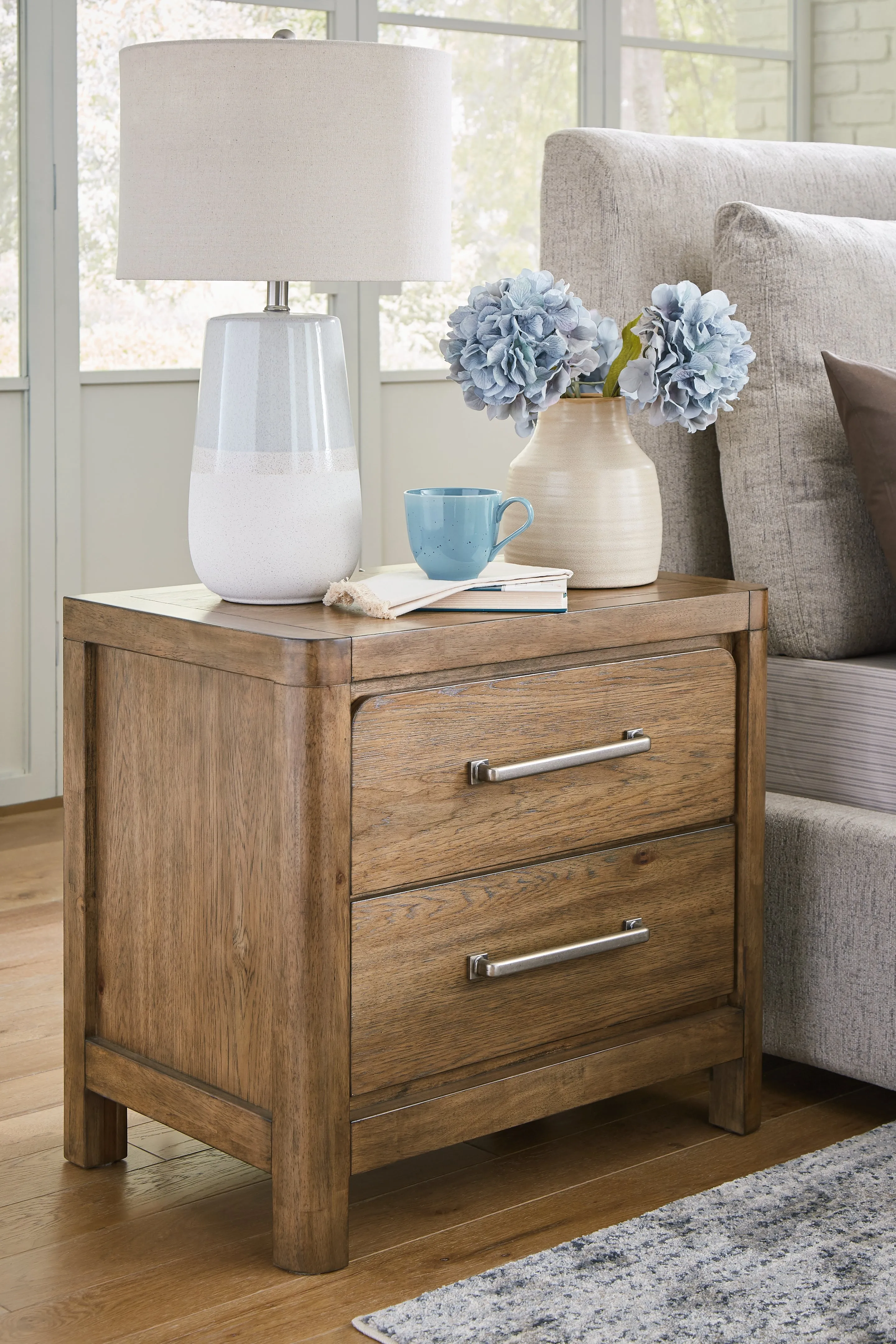 Cabalynn California King Upholstered Bed with Mirrored Dresser and Chest in Light Brown